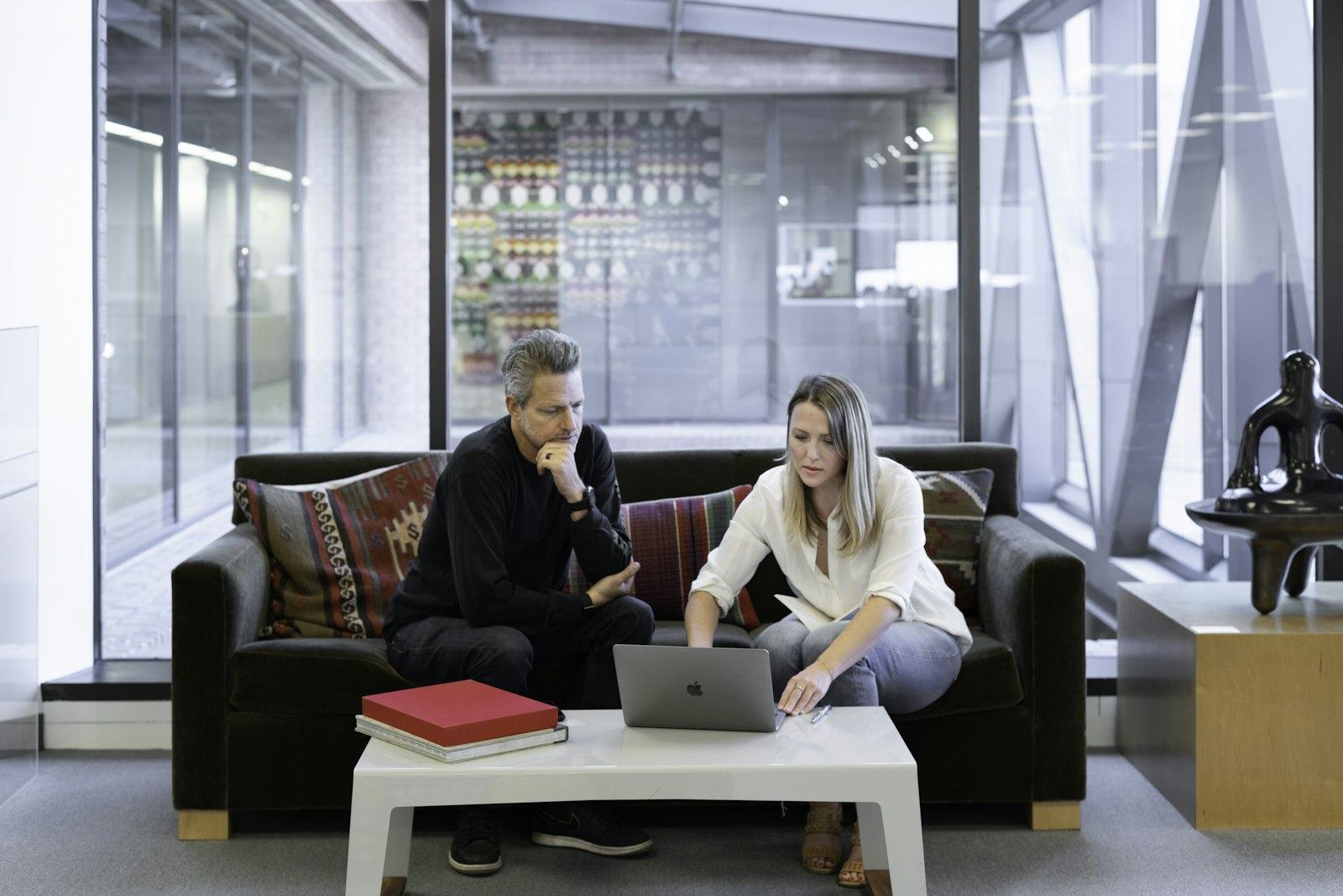 A couple browsing homes together on a laptop