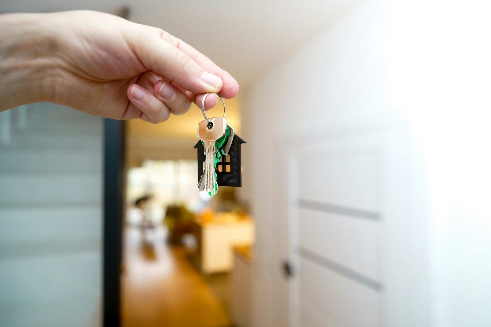Holding the keys to a new home at the front door
